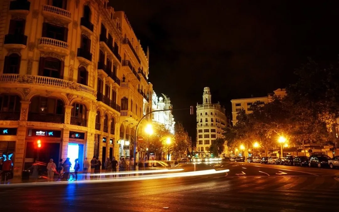 City street and historic buildings at night